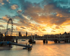 Urban wall art of the sun setting over London eye and Big Ben