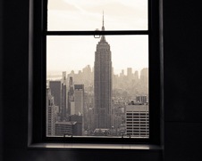 Wall art photo of the empire state building through a window