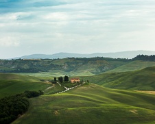 a fine art print of a villa in a valley in Tuscany