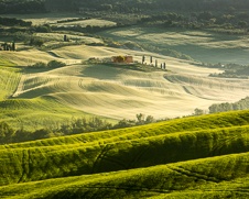 a fine art print of a villa in a valley in Tuscany